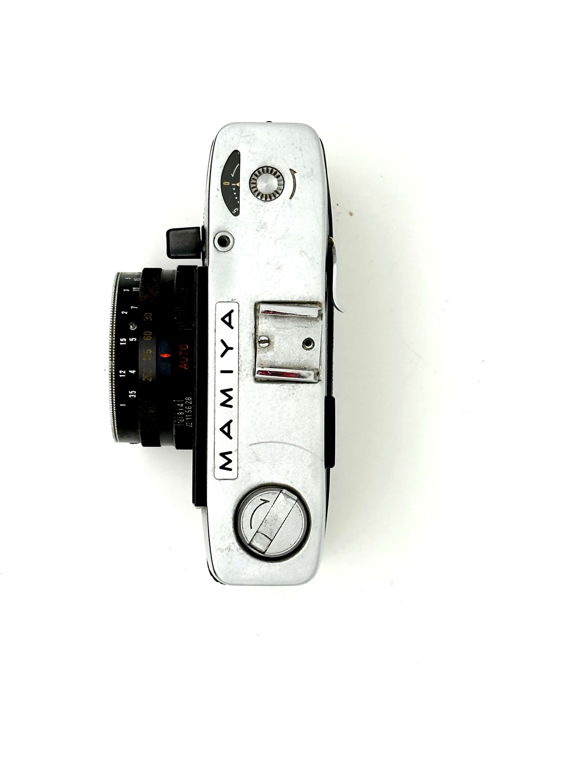 Mamiya Kominar vintage rangefinder camera top view showcasing 40mm f2.8 lens and manual controls.