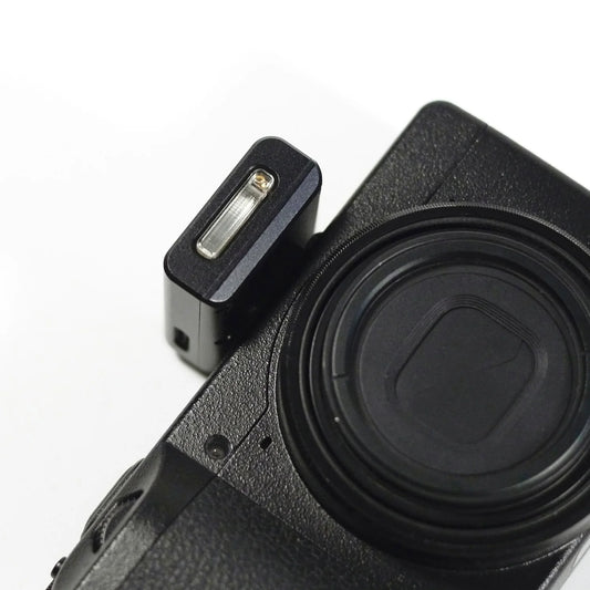 reflx lab mini flash shown on a camera