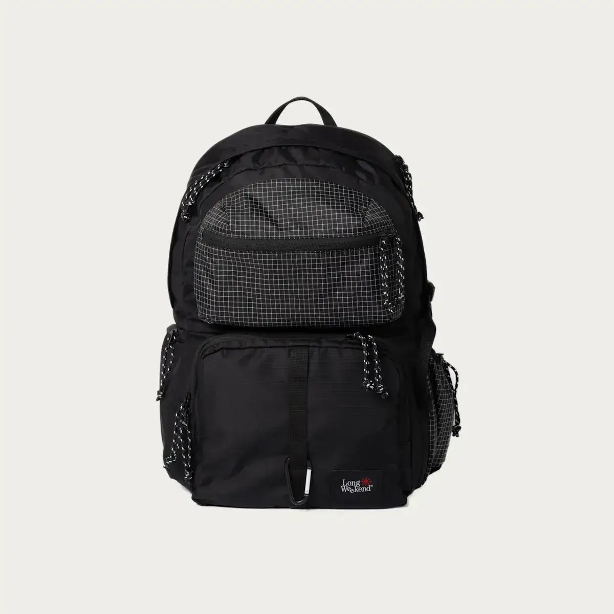 Black and grey JanSport backpack with multiple pockets and a checkered front pouch on a white background.