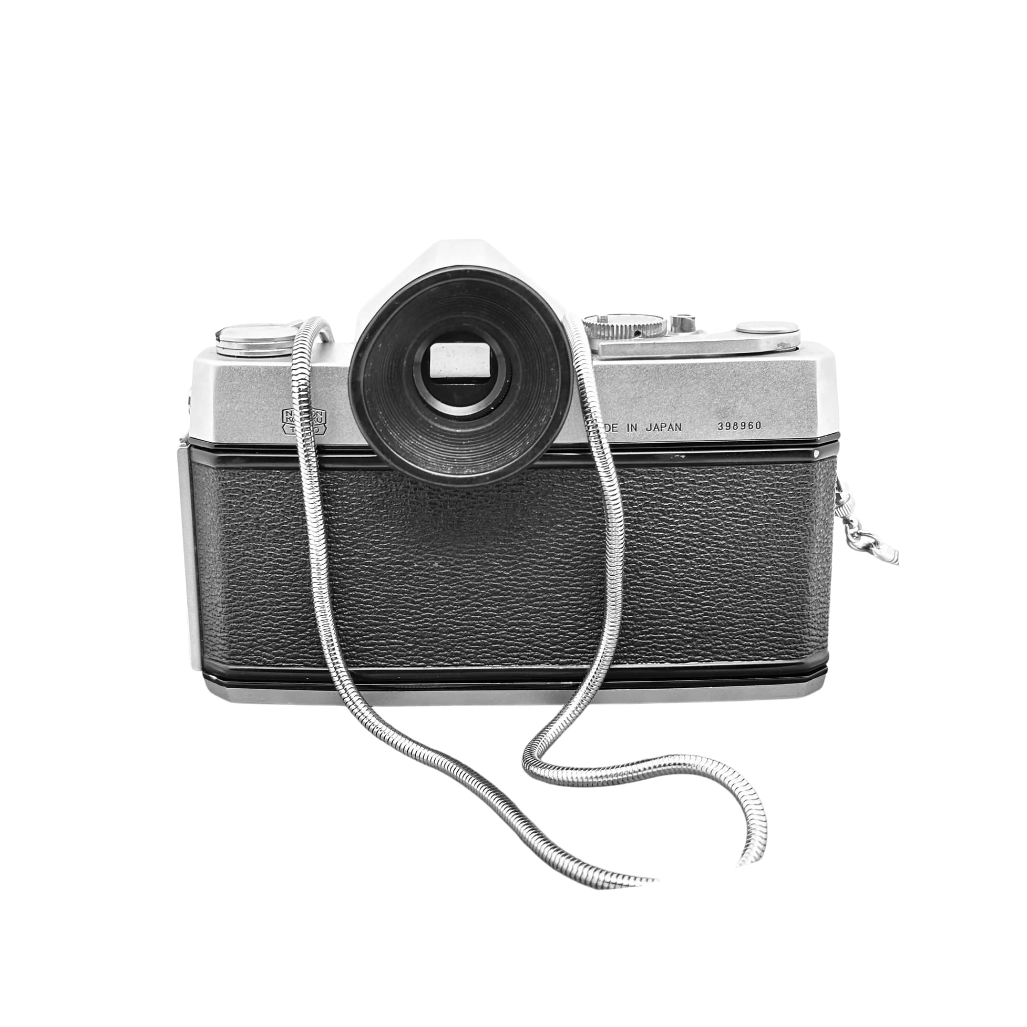 Silver and black vintage camera with textured leather body, chrome accents, and a coiled metal strap.