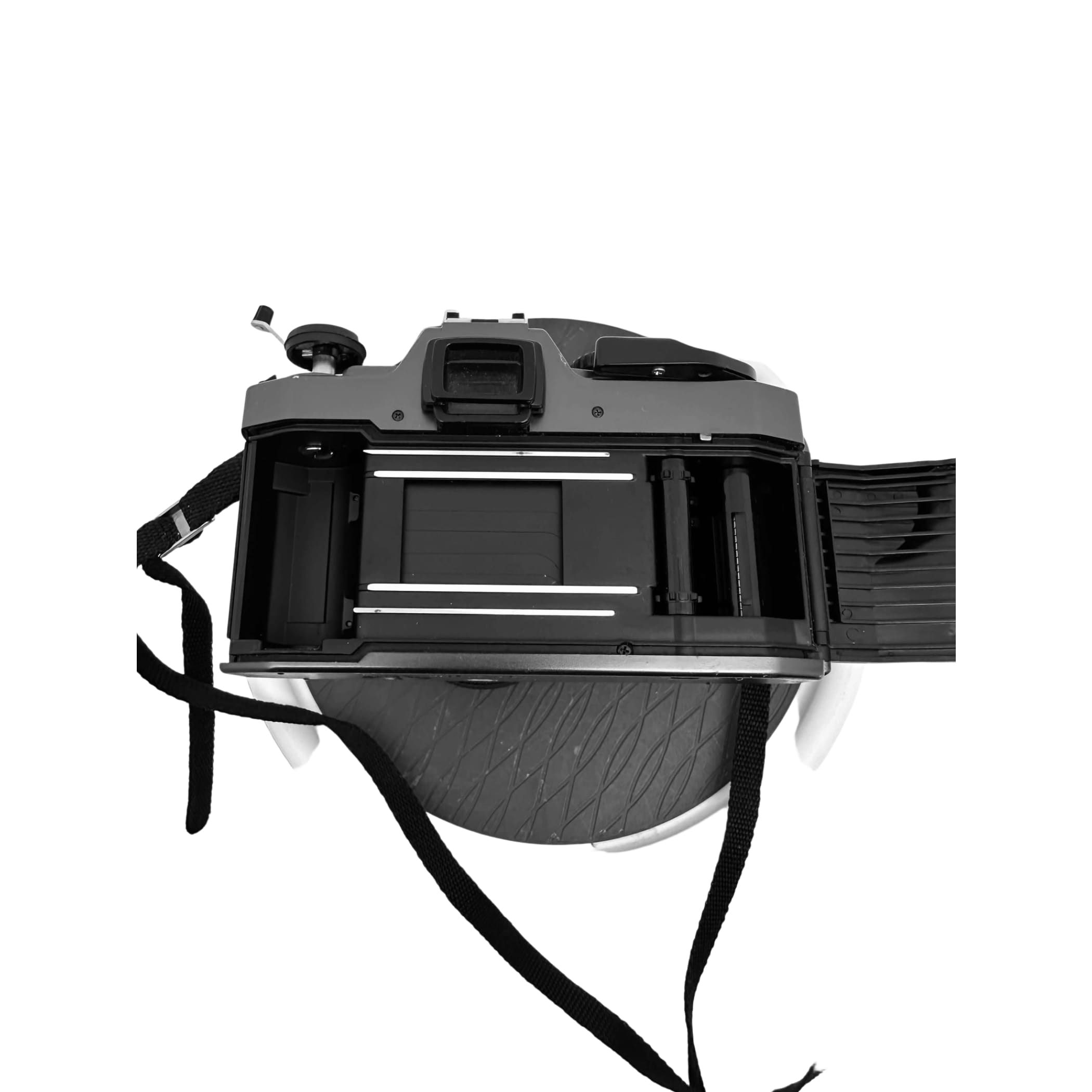 Black plastic-bodied film camera with a visible shutter mechanism and attached strap.
