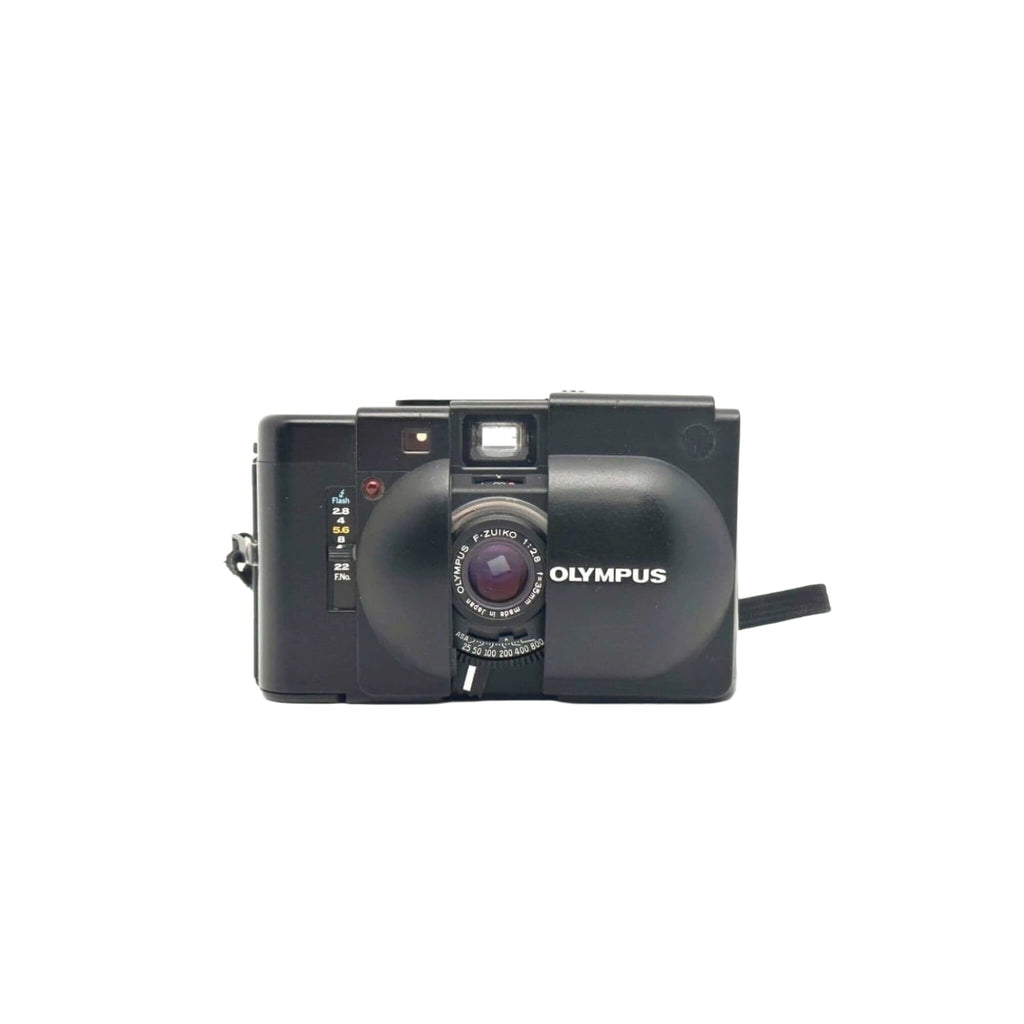 Black olympus c-203 compact camera with a prominent lens and built-in flash.