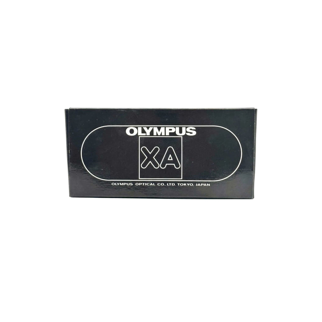 Black rectangular box for an olympus xa camera, featuring white branding and a sleek minimalist design.