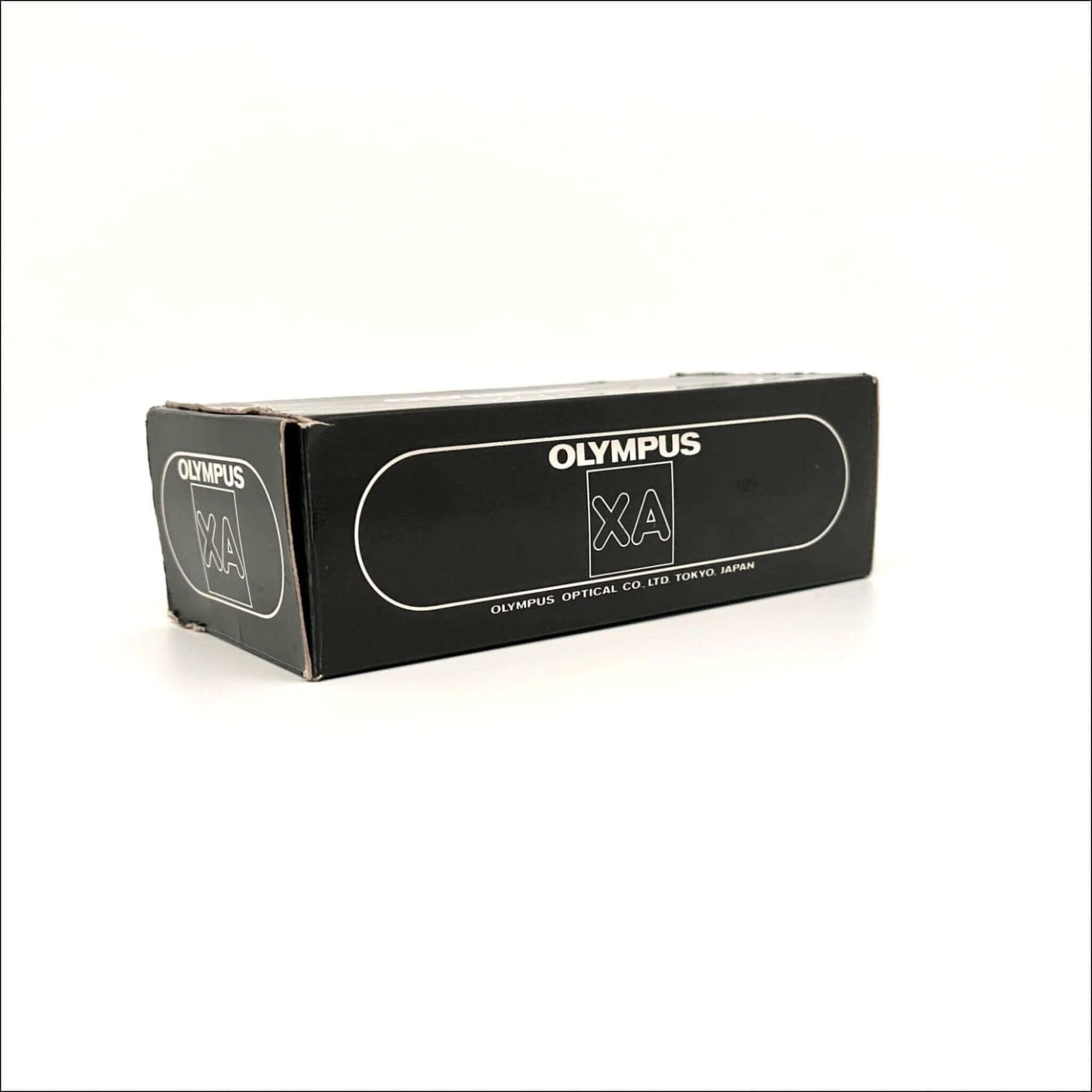 Black rectangular box with white ’olympus xa’ branding and text indicating olympus optical co.