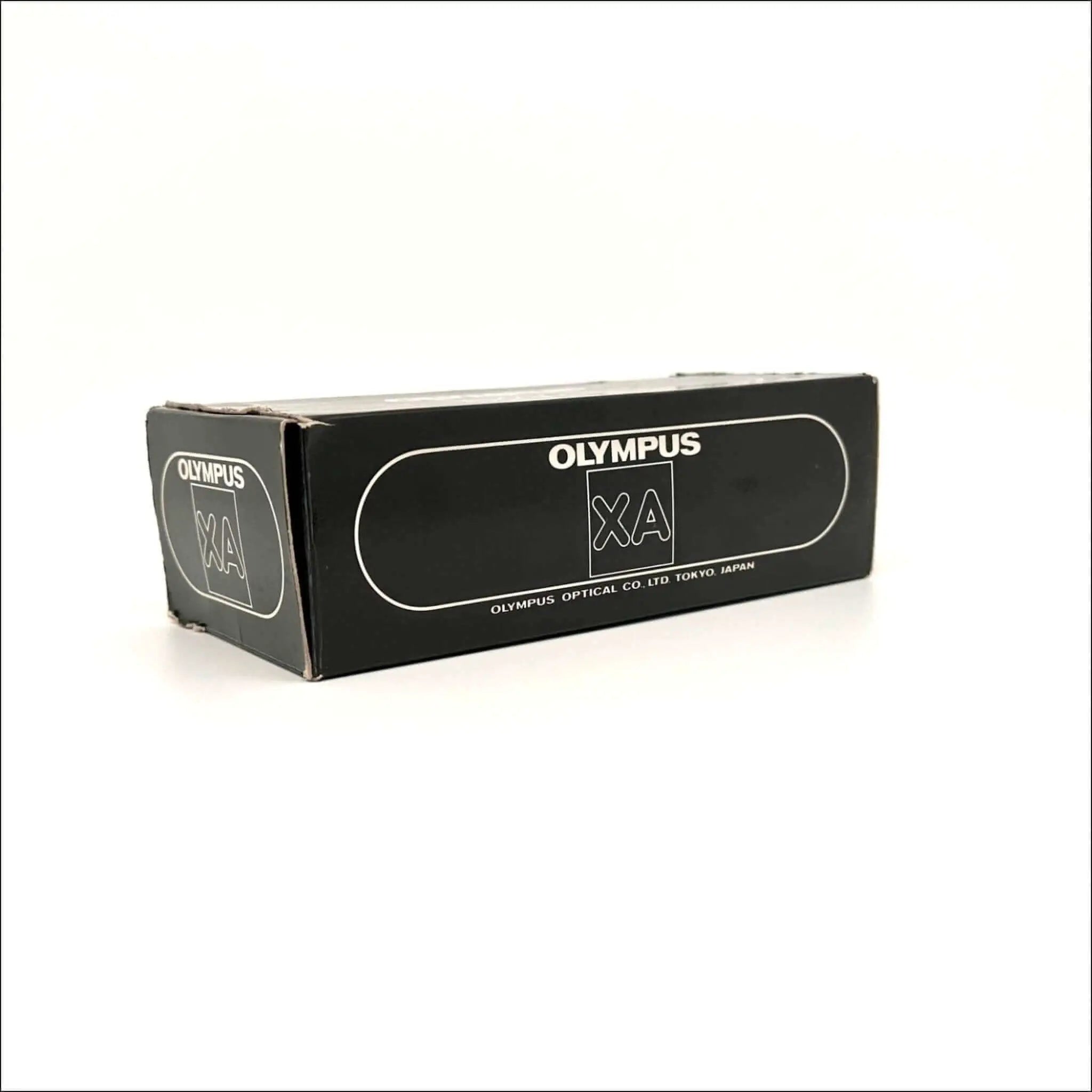 Black rectangular box with white ’olympus xa’ branding and text indicating olympus optical co.