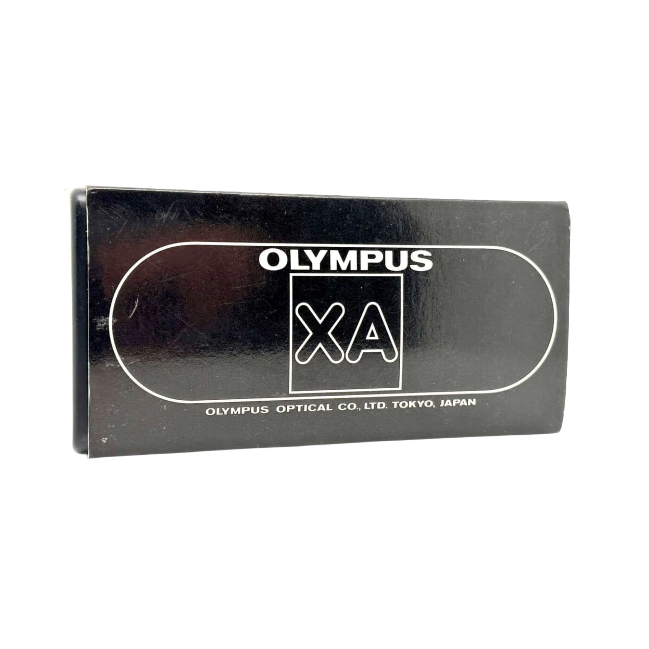 Black rectangular box for an olympus xa camera, featuring white branding and text.