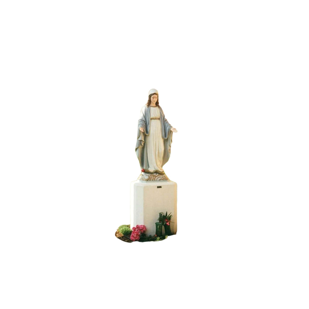 A serene white statue of the virgin mary, dressed in flowing robes with a blue sash and standing on an ornate pedestal.