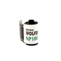 Original wolfen np100 film roll with a white label and green text, featuring black perforated edges.