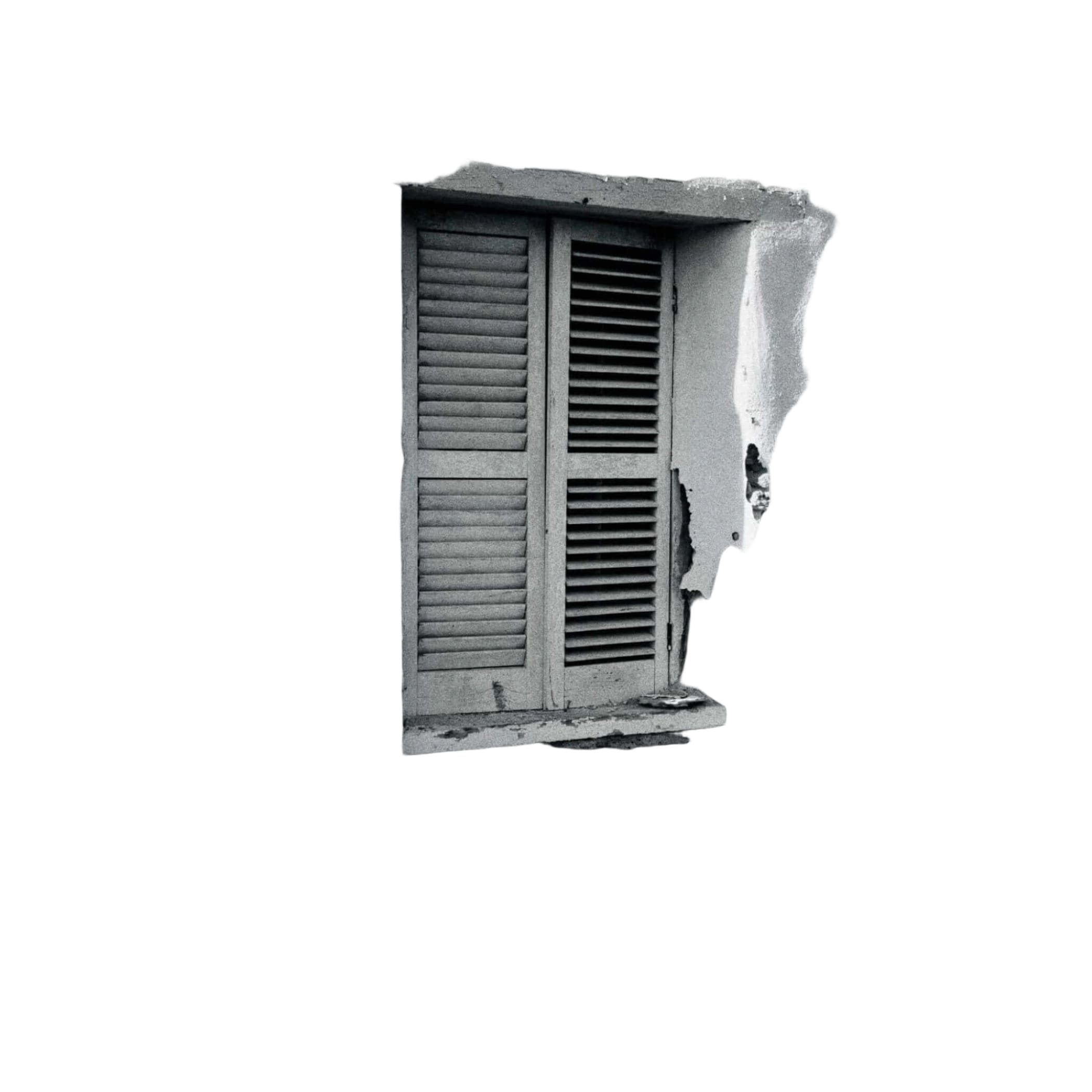 Weathered wooden shutters with horizontal slats frame a window set into a textured, peeling white stucco wall.