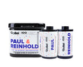 Black and white rollei paul & reinhold 100th anniversary film canisters with colorful dot patterns.