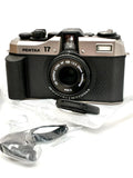 Black and silver pentax 17 35mm half-frame film camera with black leather-textured body and mounted hf 28mm f 3.5 lens