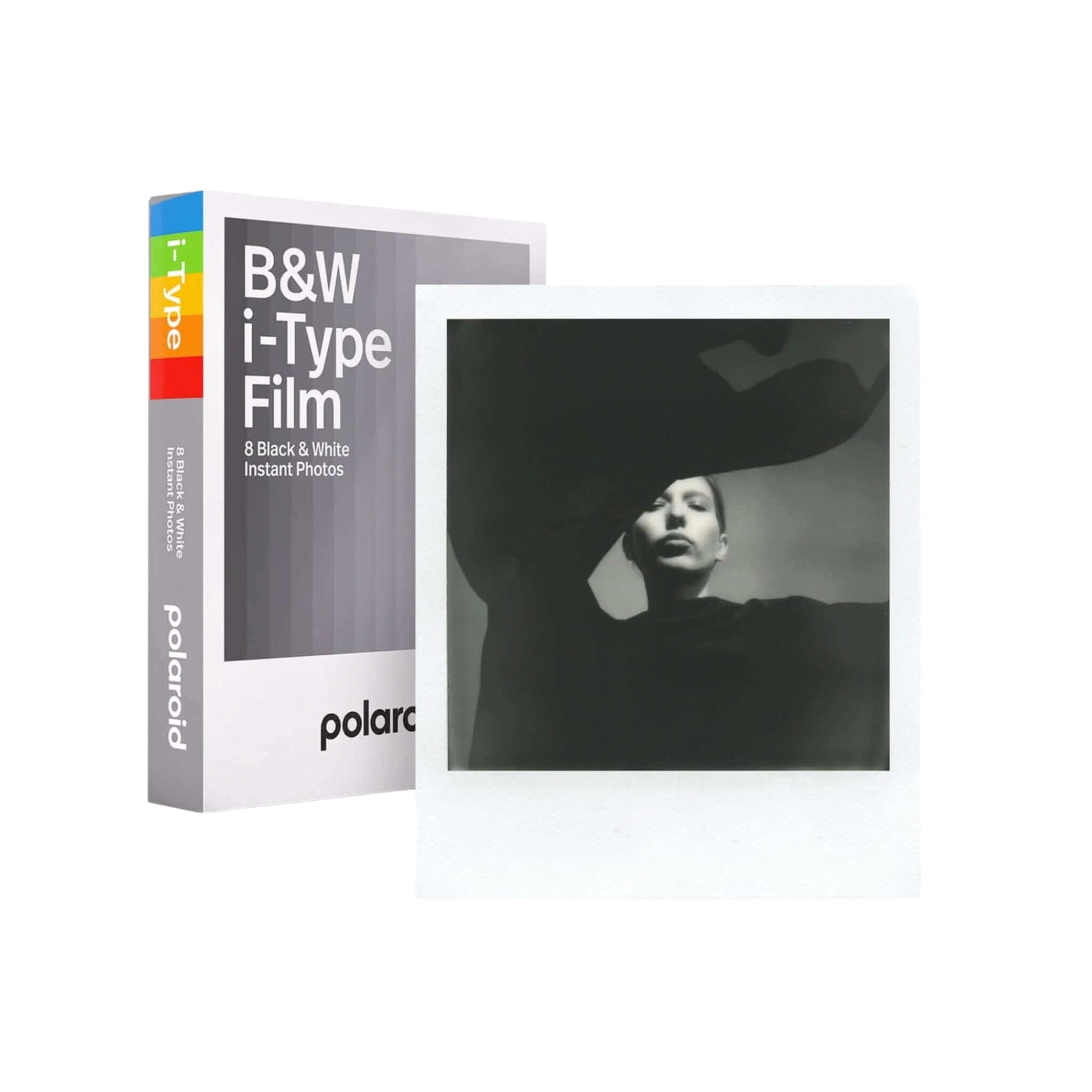 White polaroid i-type film box with rainbow-colored spine and a black-and-white instant photo displayed beside it.
