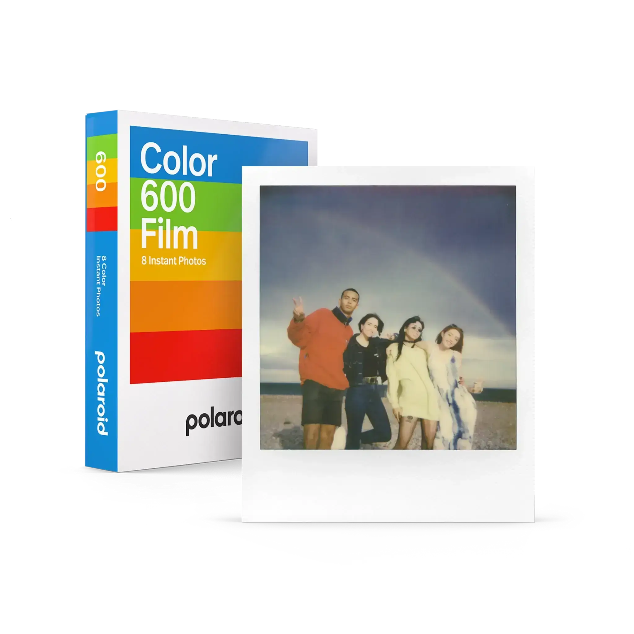 Polaroid color 600 film pack with rainbow-striped box and a white-bordered instant photo of four people on the beach.