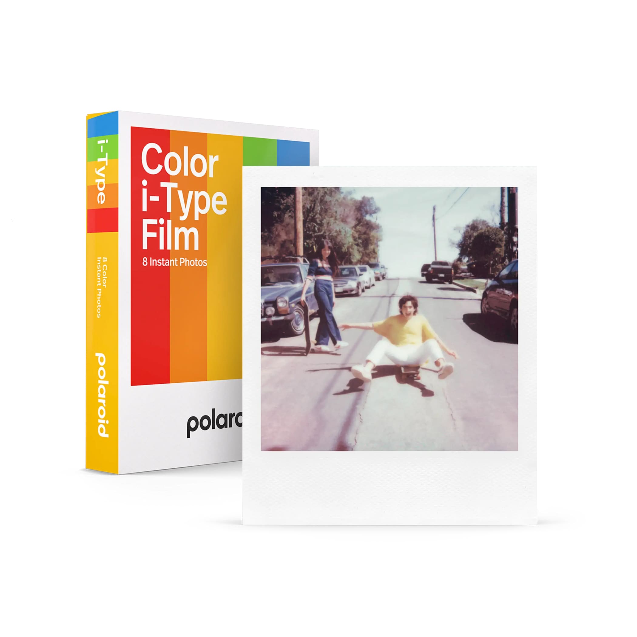 Polaroid color i-type film pack with rainbow-striped box and a sample instant photo of someone in yellow shirt on skateboard.