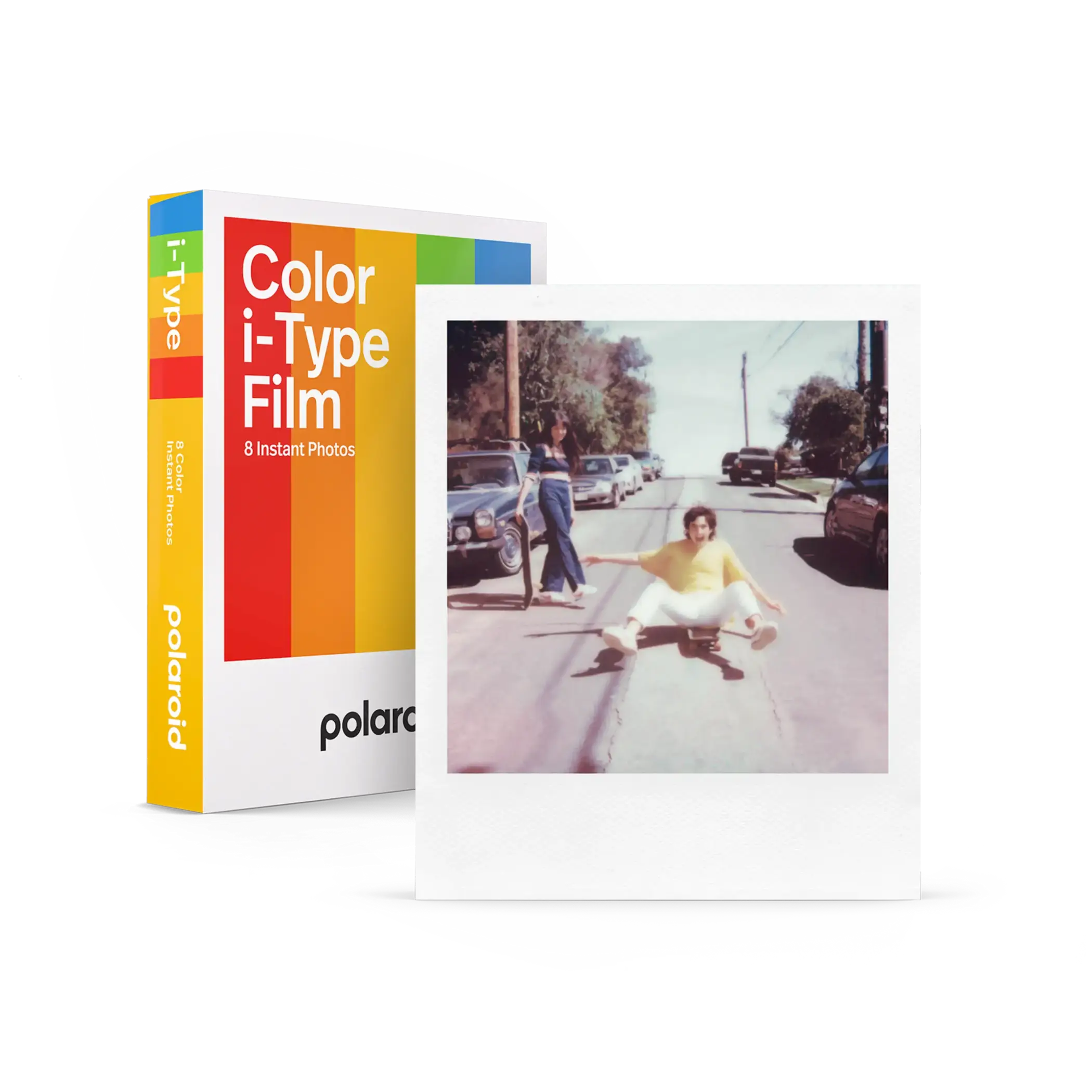 Polaroid color i-type film pack with rainbow-striped box and a sample instant photo of someone in yellow shirt on skateboard.
