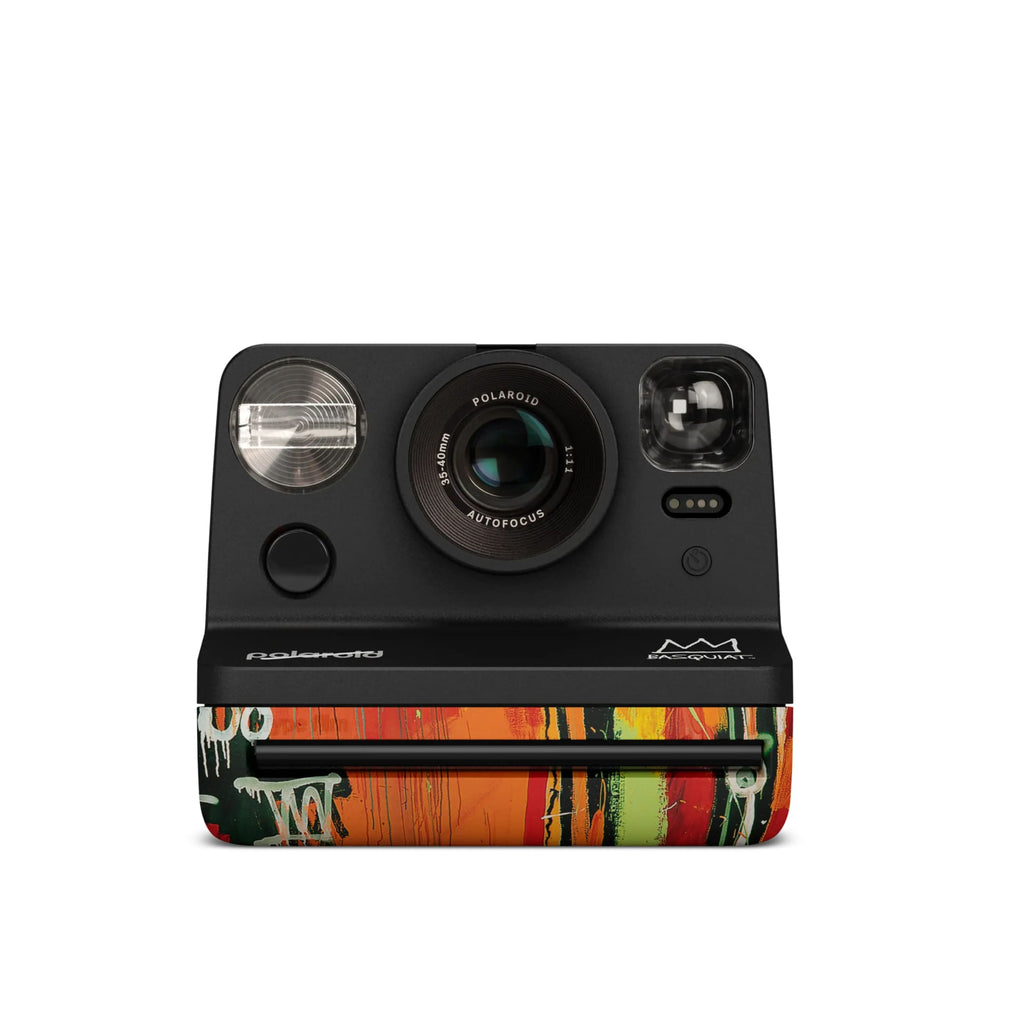 Black polaroid m600 instant camera with a vibrant graffiti-style design on its lower half.