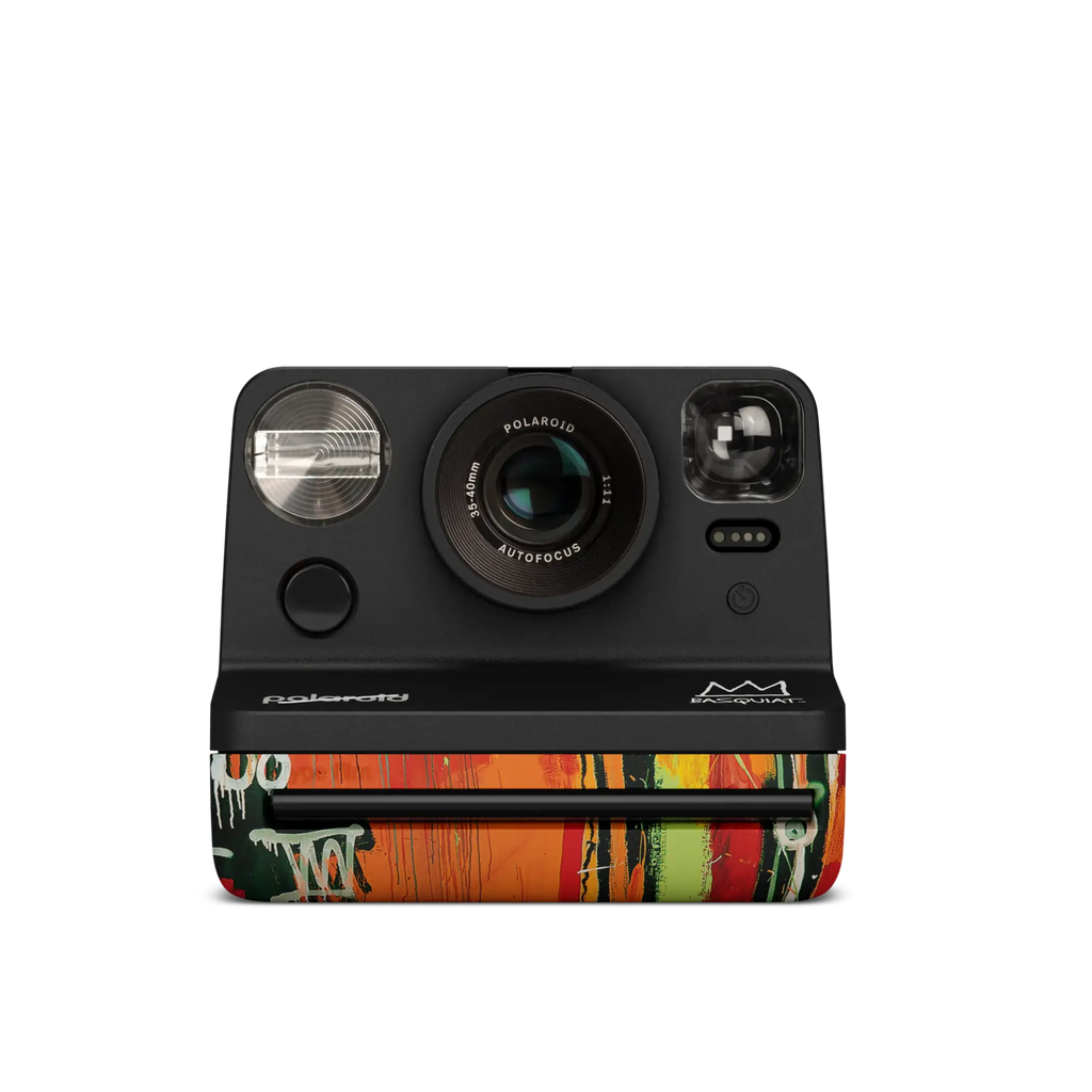 Black polaroid m600 instant camera with a vibrant graffiti-style design on its lower half.