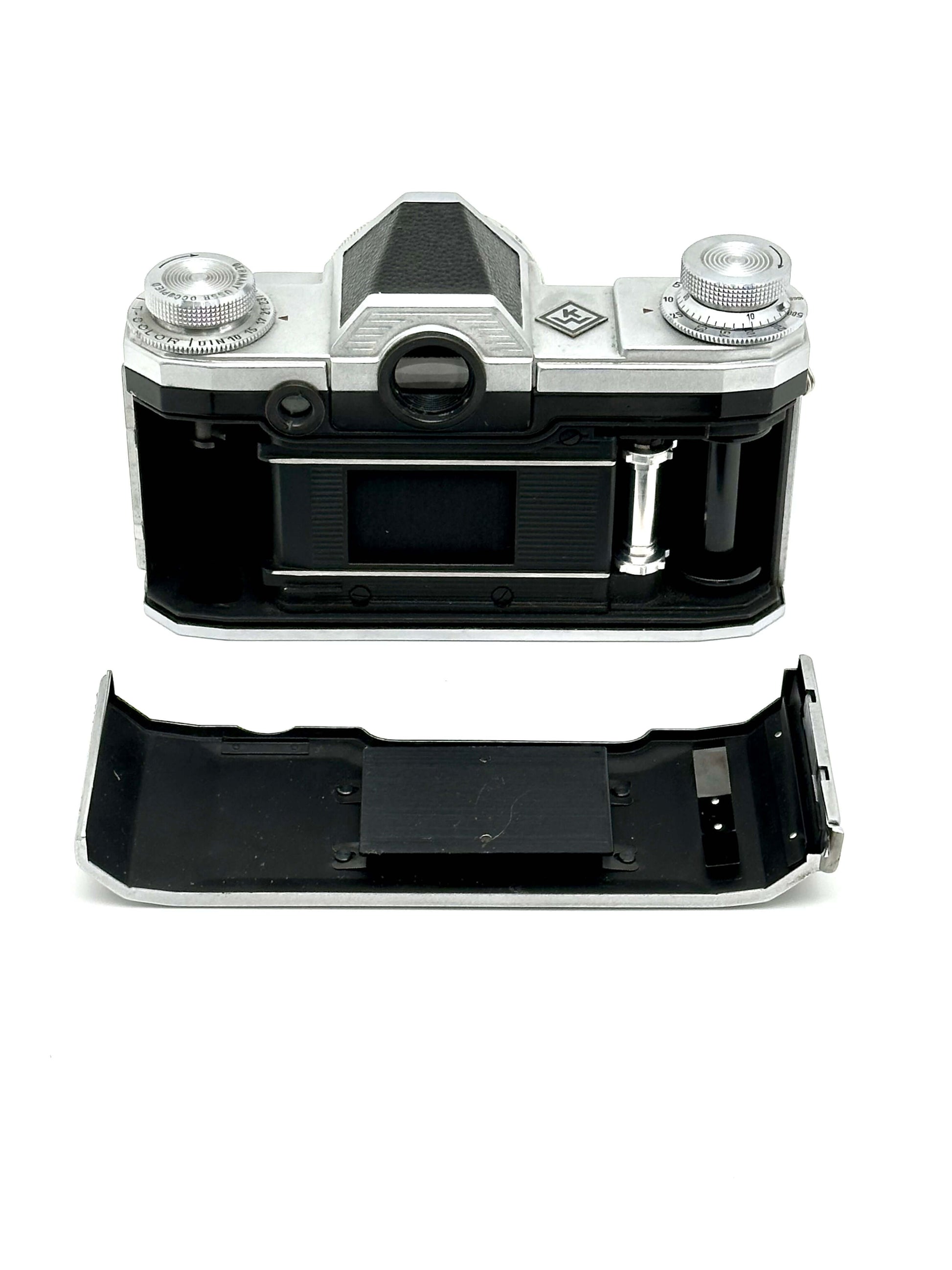 Praktina FX vintage 35mm film camera rear view with removable bottom plate and silver dials.