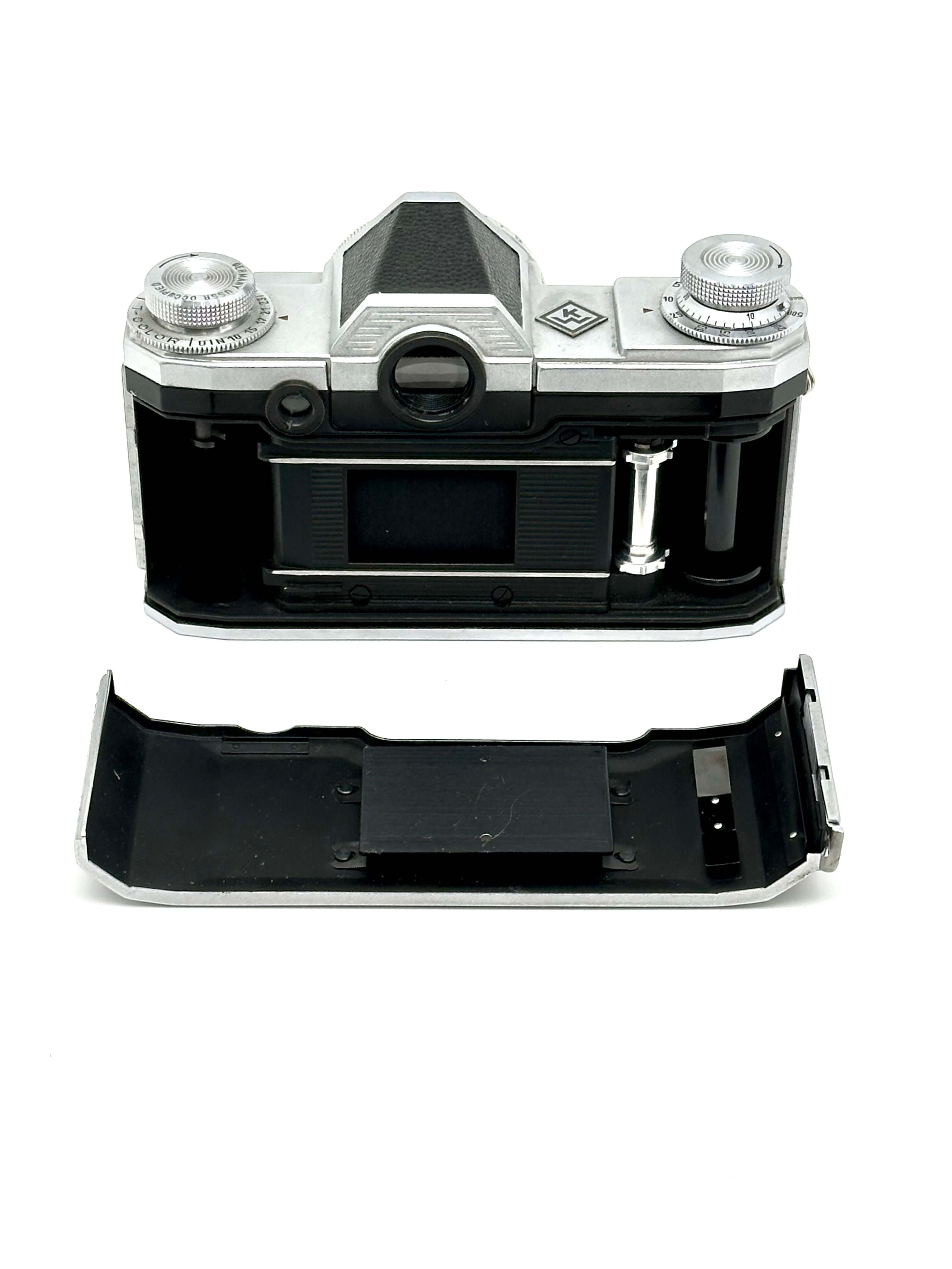 Praktina FX vintage 35mm film camera rear view with removable bottom plate and silver dials.