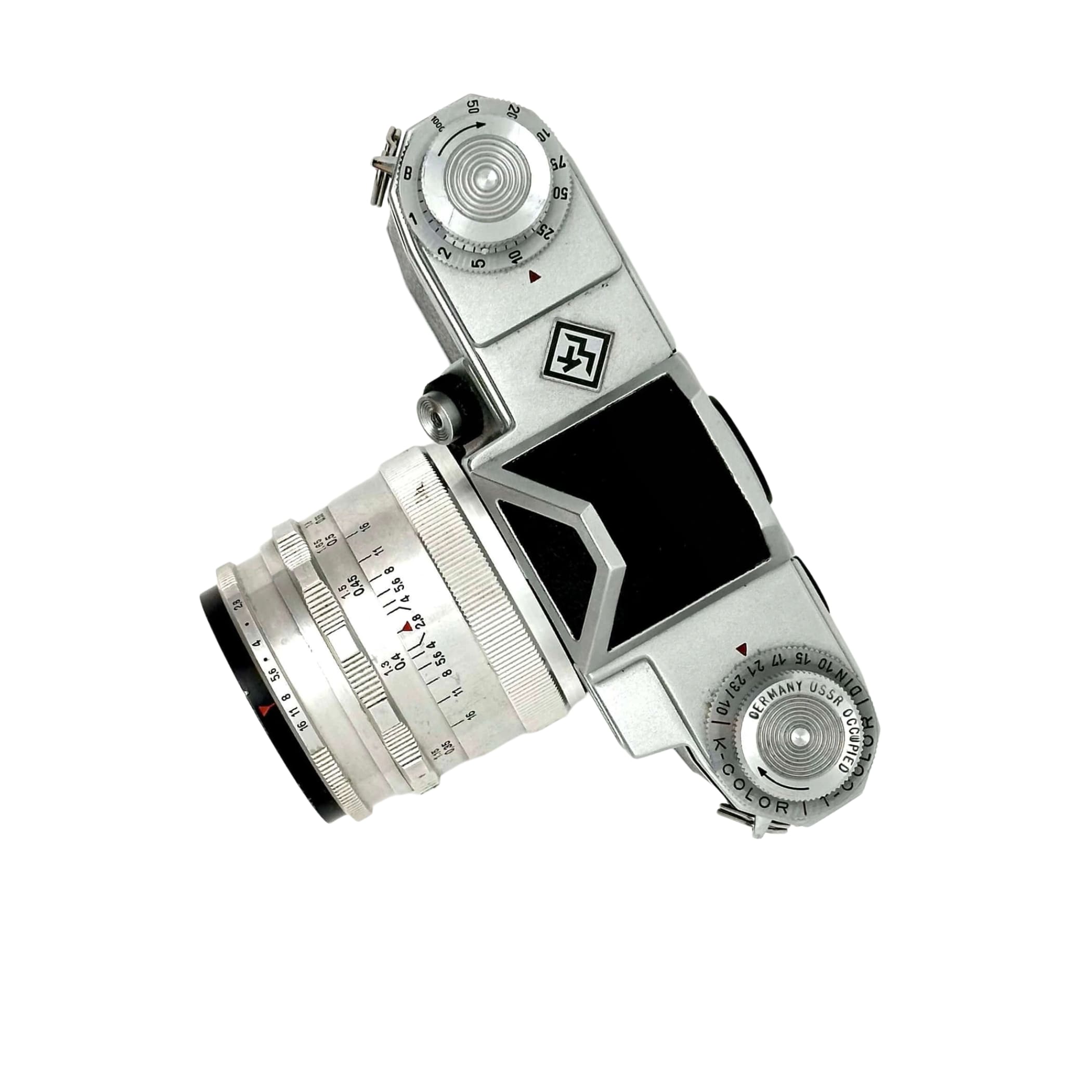 Silver-bodied vintage camera with a matching lens, featuring engraved markings and a black viewfinder window.