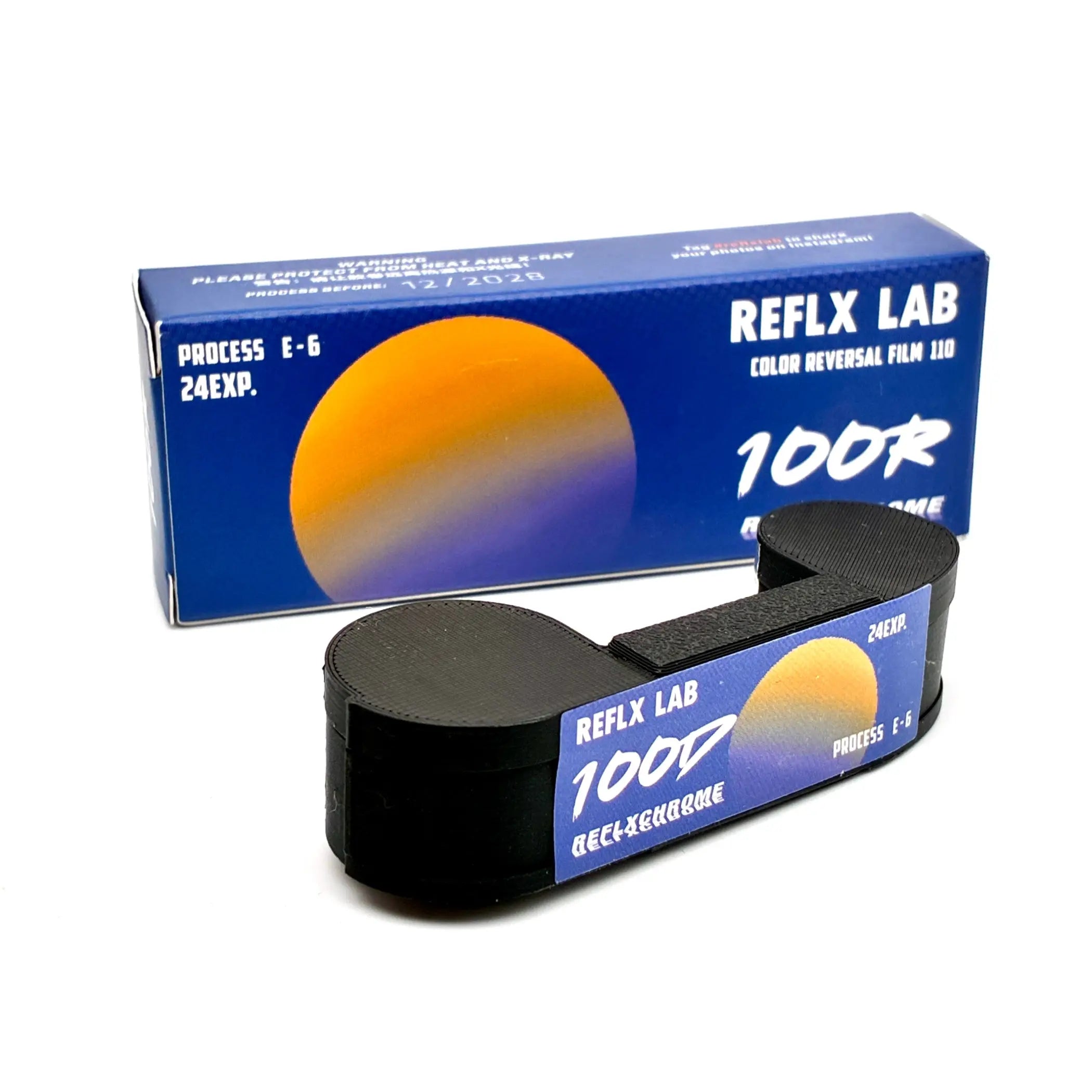 Black spool of reflx lab 100r color reversal 110 film with blue and orange gradient label for vibrant lab 100r color shots