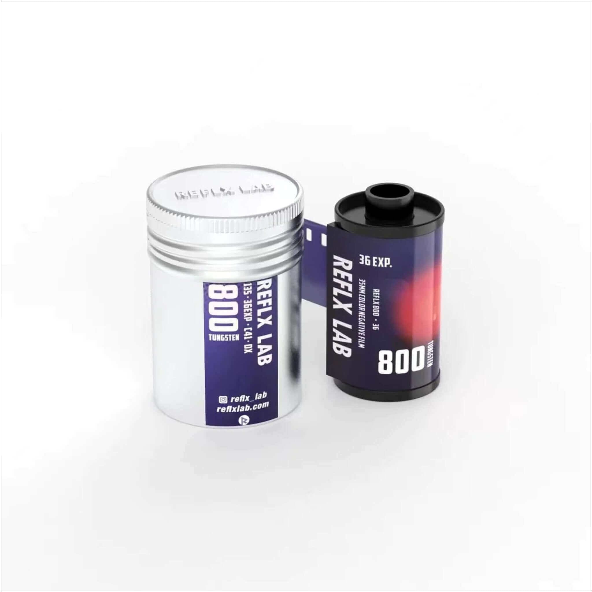 Silver cylindrical container with purple label holding reflex lab 800t tungsten film next to a black and red roll of the same brand’s 35mm color negative film.