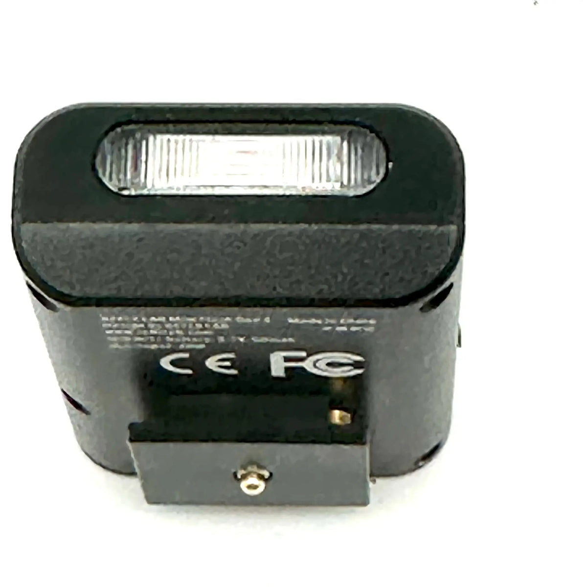 Black rectangular flash unit with a translucent, ribbed front panel and textured casing.