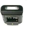 Black rectangular flash unit with a translucent, ribbed front panel and textured casing.