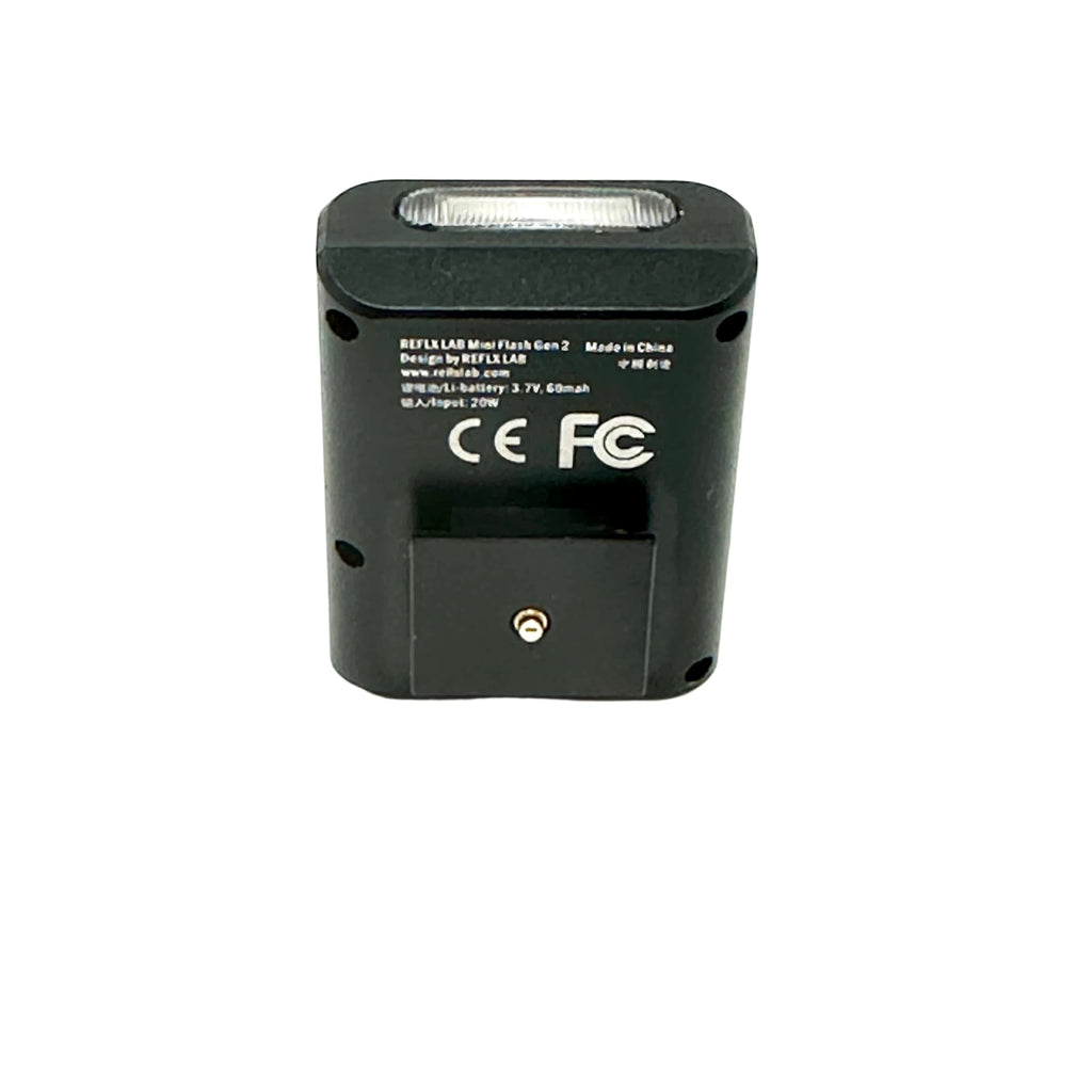 Black reflex lab mini flash gen 2 flash unit with a rectangular shape and a translucent front panel.