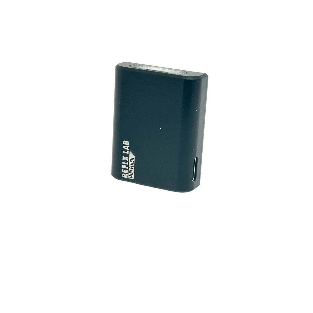Dark teal reflex lab miniflash portable charger with a sleek rectangular design and subtle branding on the side.