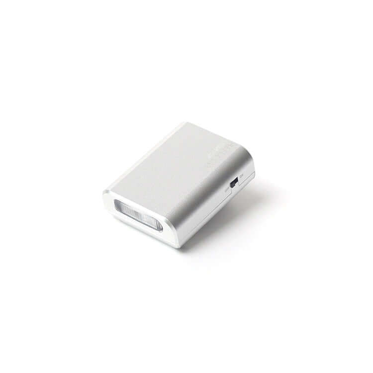 Reflx Lab Mini Flash V2 in sleek silver design, compact and lightweight for portable photography.