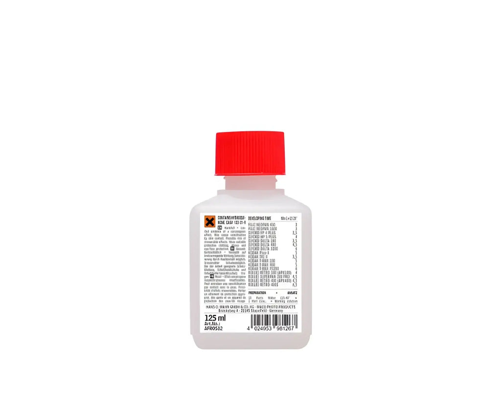A clear plastic bottle with red cap and white label containing 125 ml of rollei compard r09 spezial film developer