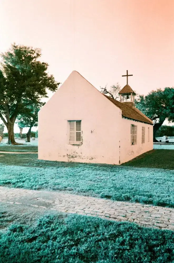 Small pale pink church captured on Lomography Turquoise film