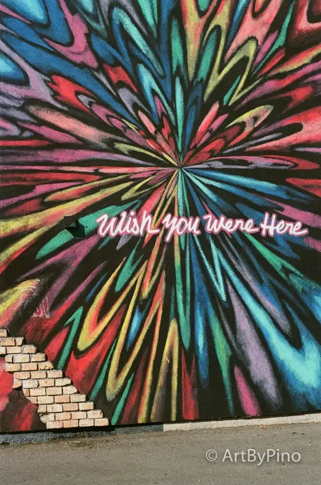 Vibrant psychedelic mural with rainbow swirls and wish you were here text in Texas view fullsize