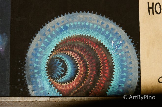 Vibrant spiraling mural in Kiro 400, Kodak Ultramax 400, Lomography 400 comparison, Texas view fullsize