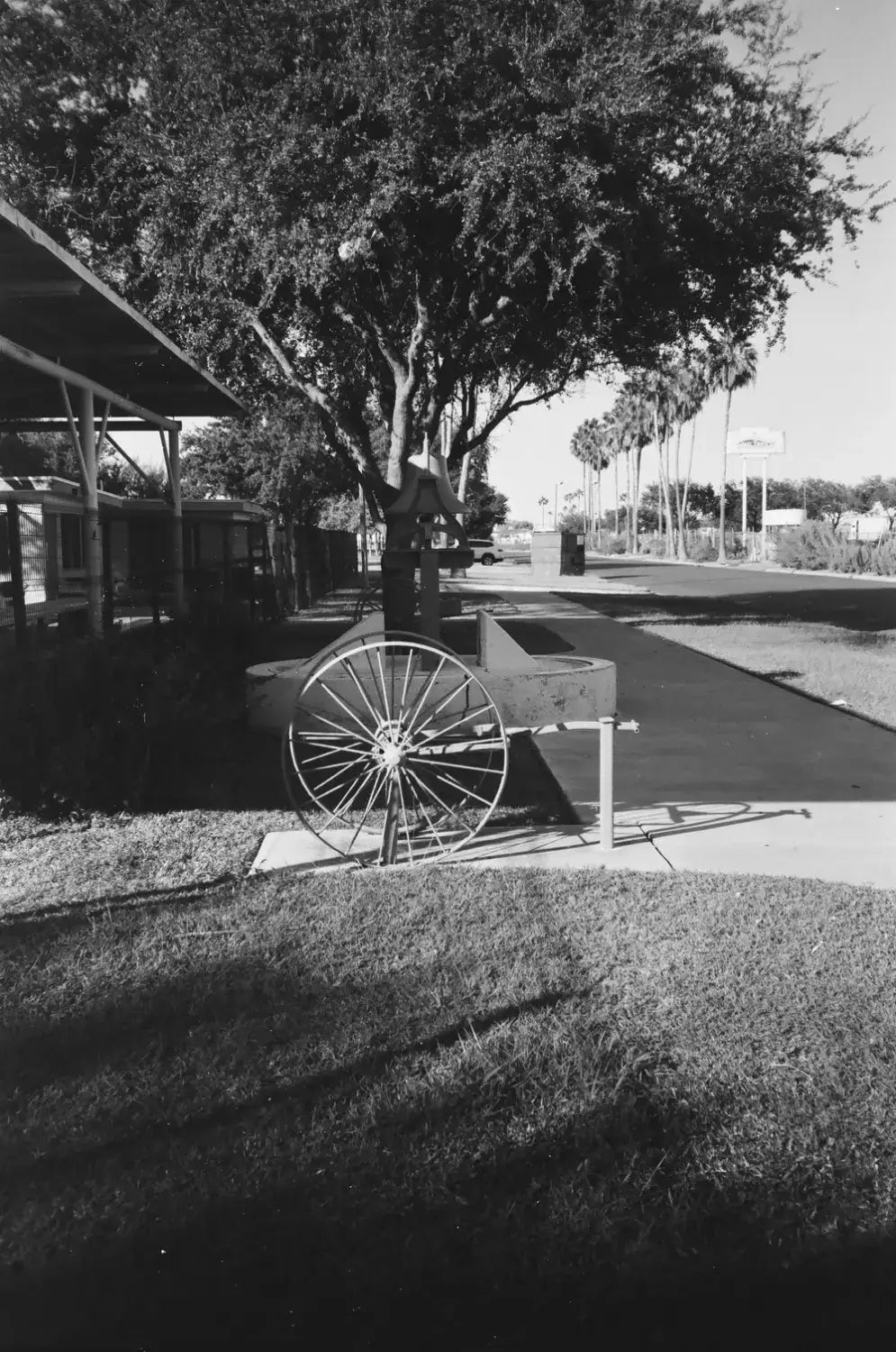 Vintage wooden cart with spoked wheel in Catlabs x Film Kodak Tri-x setup