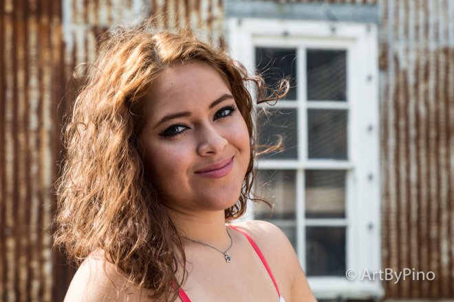 Best seniors graduation photo of woman in red top and necklace