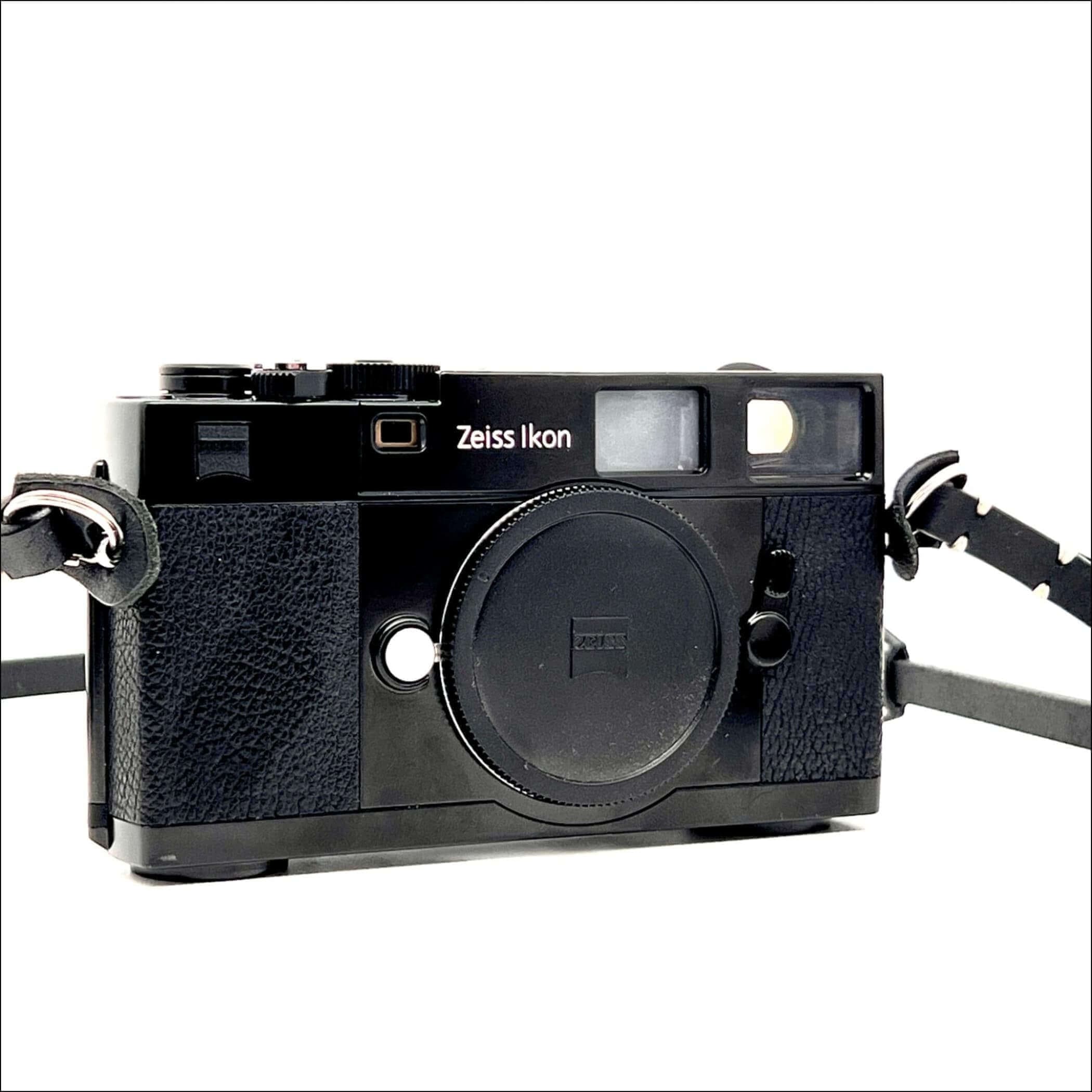Black zeiss ikon rangefinder camera with textured leather grip and chrome accents.