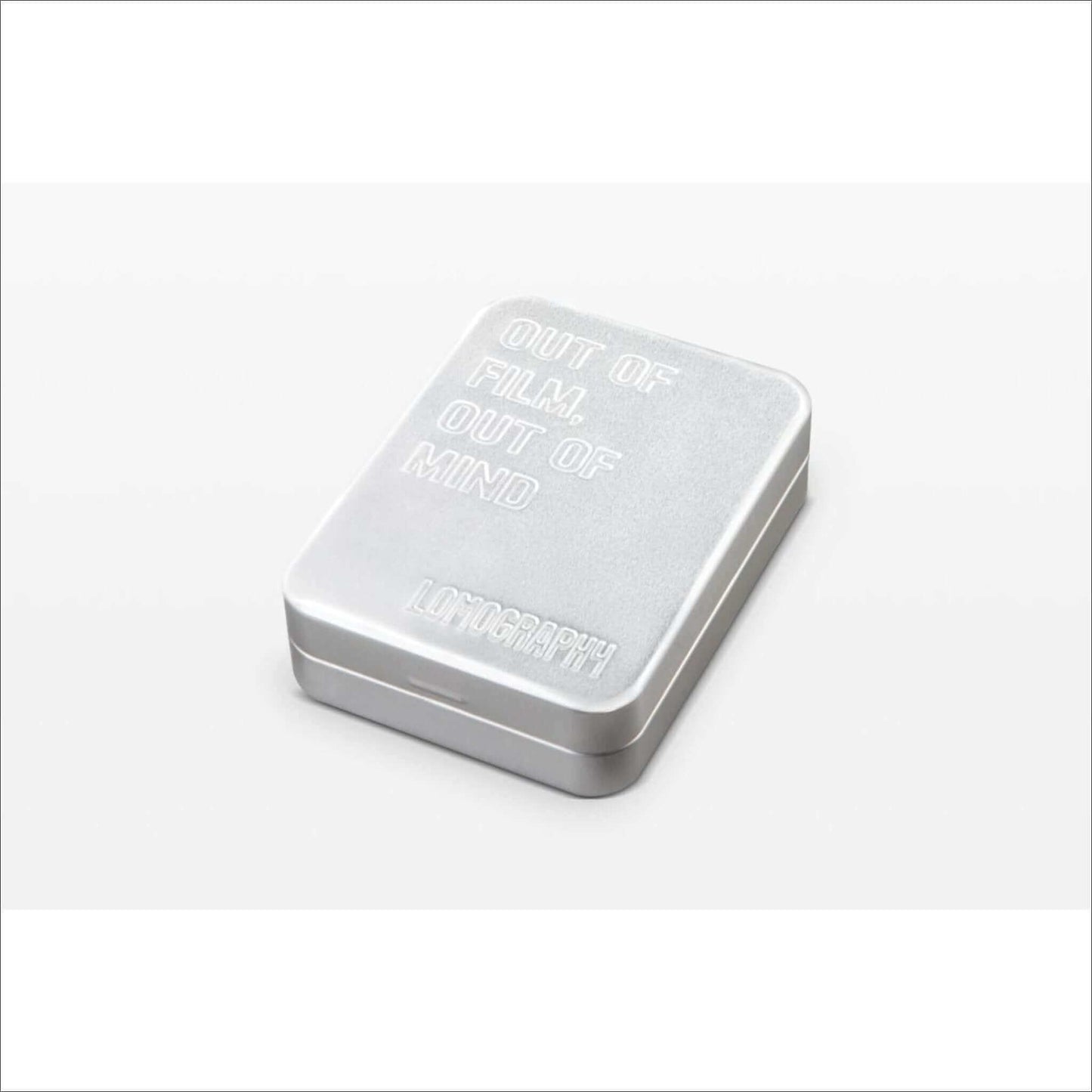 Lomography Metal Film Case for 135/120 featuring a sleek silver design with embossed text 'Out of Film, Out of Mind'