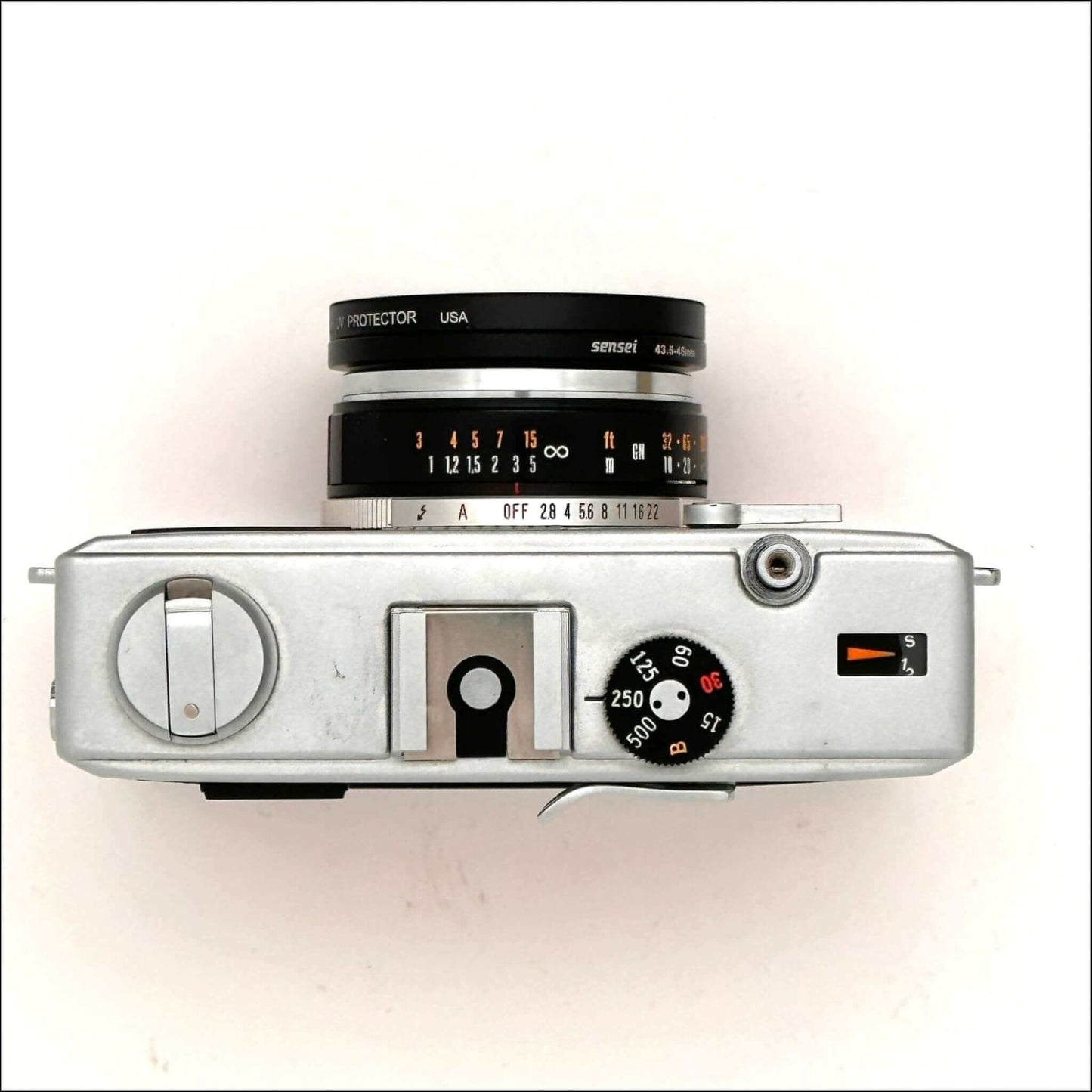 Top view of Olympus 35 RC 35mm rangefinder film camera showcasing lens and control dials.