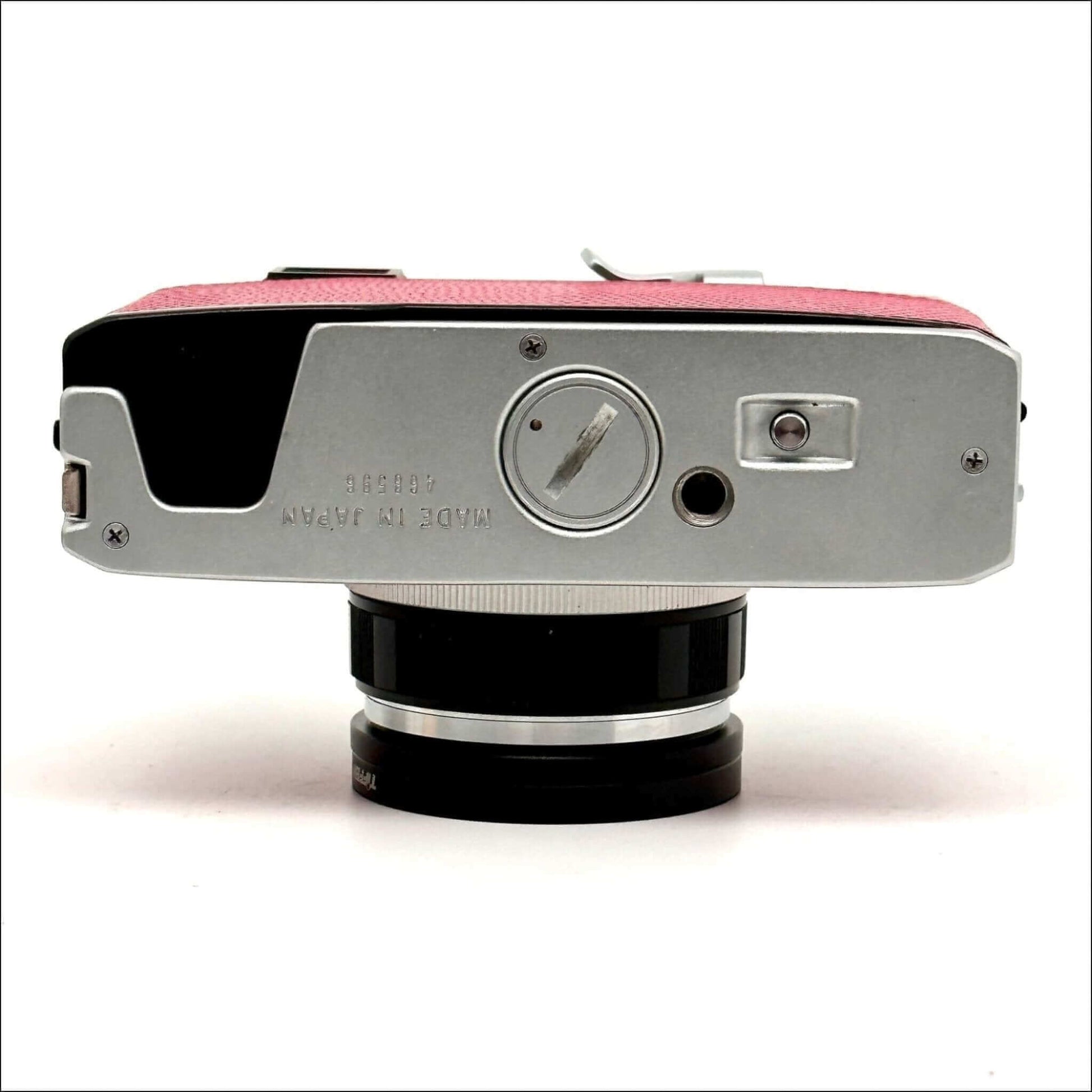 Olympus 35 Rc 35mm pink rangefinder camera with a sleek design and retro finish.