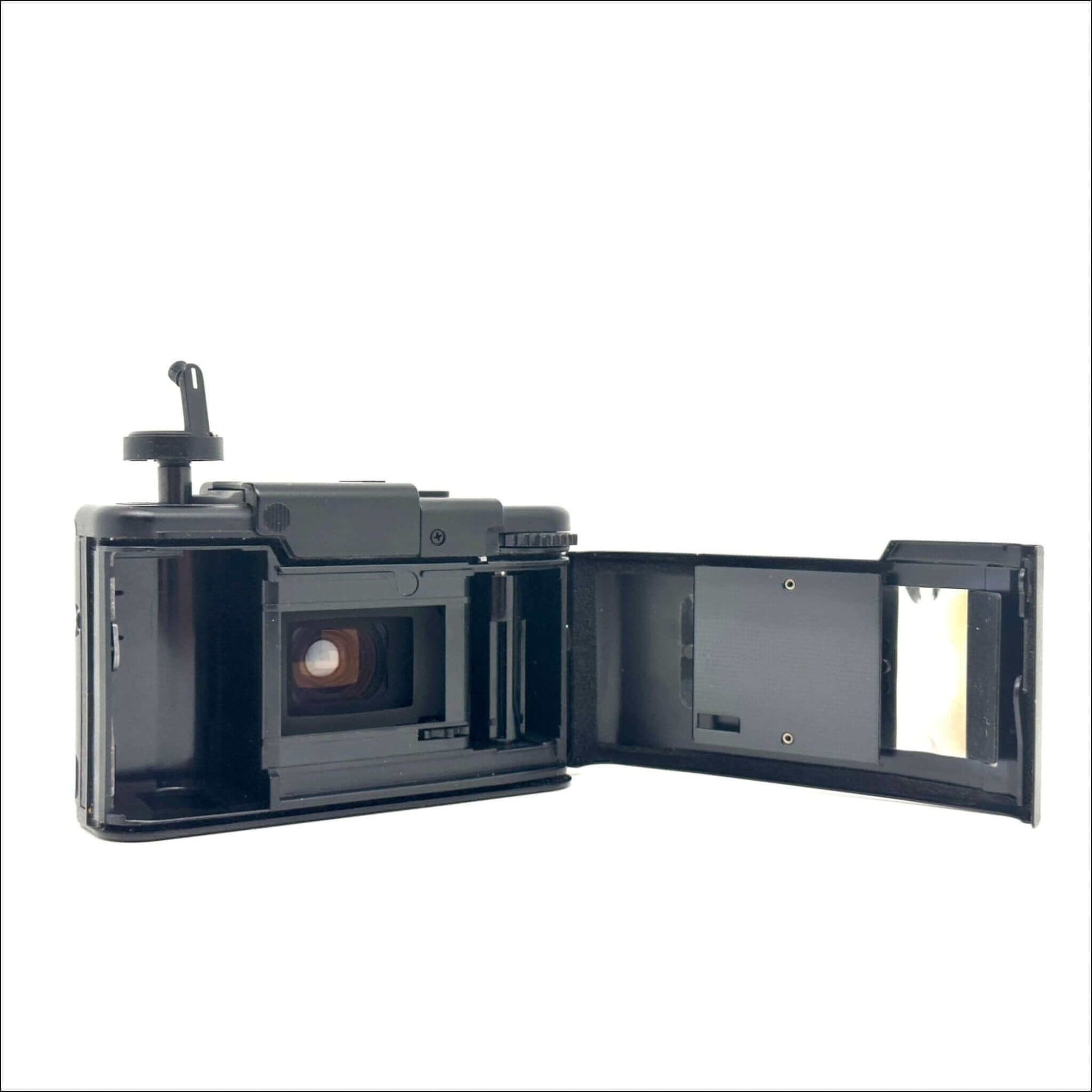 Olympus XA used 35mm vintage film camera with open back, showing inside view and mechanics, in excellent condition.