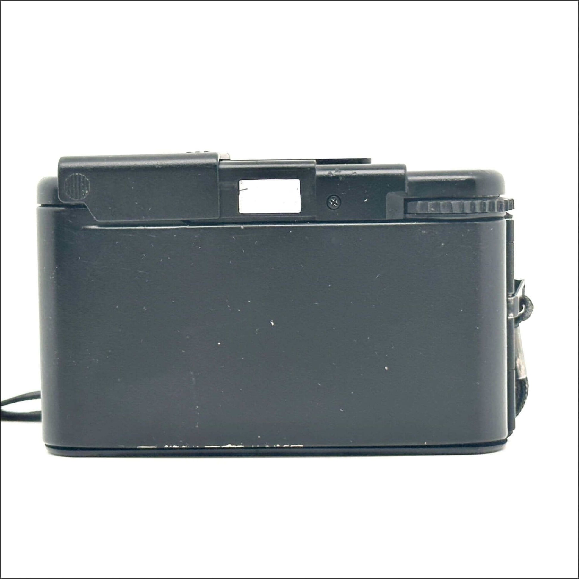 Back view of Olympus XA used 35mm vintage film camera, showcasing its minor scratches and classic design.