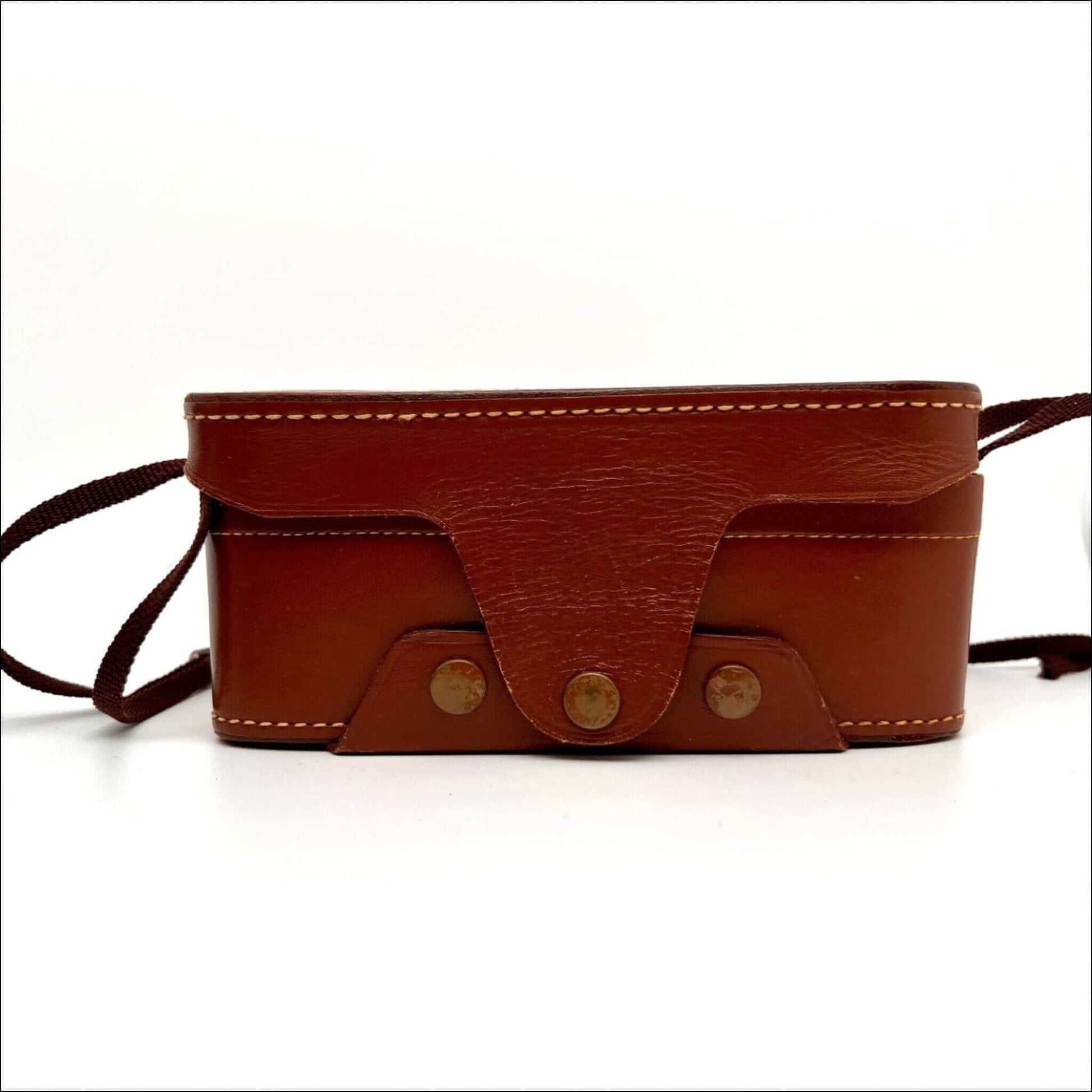 Brown leather case for Kodak used Stereo 35mm film camera with stitching detail, showcasing vintage style.